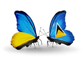 Two butterflies with flags  Ukraine and Saint Lucia