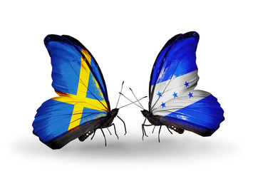 Two butterflies with flags Sweden and Honduras