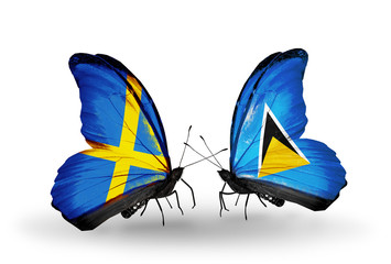 Two butterflies with flags Sweden and Saint Lucia
