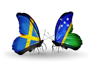 Two butterflies with flags Sweden and Solomon Islands