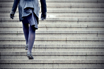 Person walking up the stairs