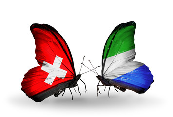 Two butterflies with flags Switzerland and Sierra Leone