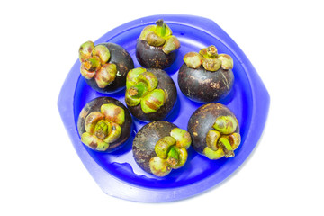 mangosteen in blue dish on white background