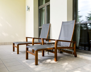 Two chaise longue on balcony