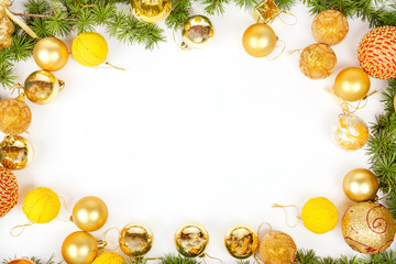 New Year decoration with pine or fir and many yellow ornaments b