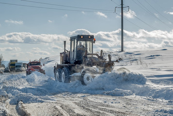 Snow grader in action