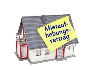Haus mit Zettel und Mietaufhebungsvertrag
