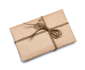 parcel wrapped with brown kraft paper isolated on white backgrou