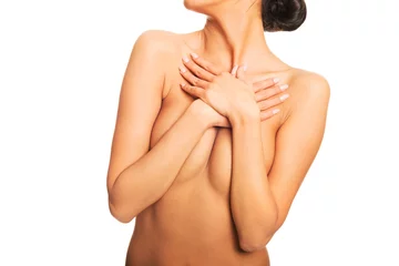 Foto op Canvas Slim nude woman covering her breast © Piotr Marcinski