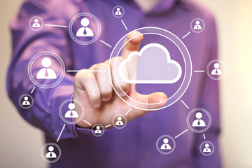 Businessman pushing virtual button cloud icon