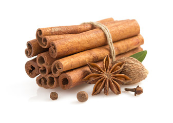 cinnamon sticks, anise star and spices on white