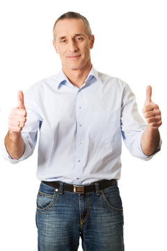 Portrait of mature man gesturing ok sign