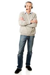 Full length of call center man with folded arms