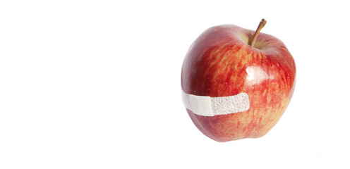 Isolated damaged red apple on white background