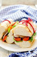 sandwich with meat, spinach and tomato