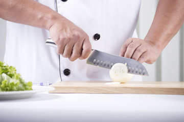 Chef cutting the onion