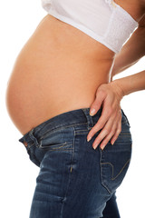 Pregnant woman standing with back pain