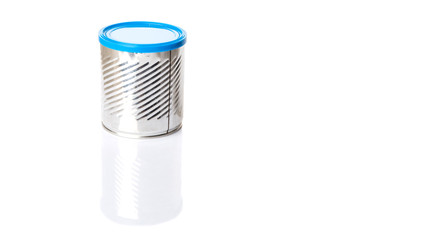 Empty tin can with blue lid over white background 