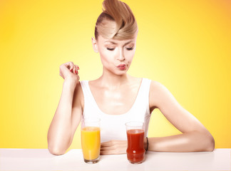 Attractive blonde woman with fruit juice.