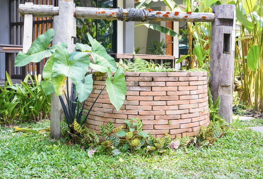 brick water well decorated in the garden