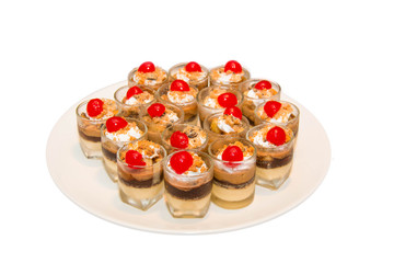 Banoffee pie in a mini glass, spilled with caremel and whipped c