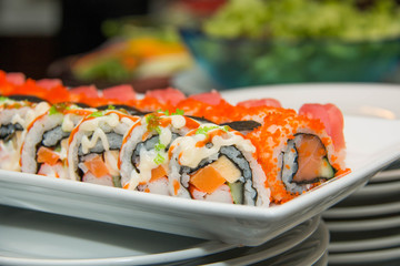 Japanese seafood sushi roll on the white plate.