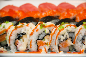 Japanese seafood sushi roll on the white plate.