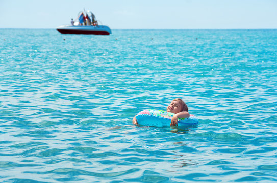 The child enjoys bathing in the sea