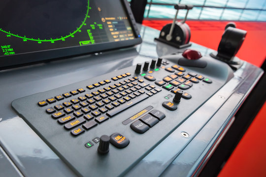 Modern ship control panel with radar screen