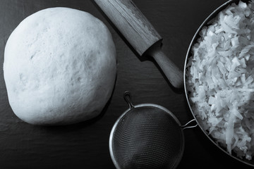 Rolling pin, dough and a cabbage filling for pie. Tinted