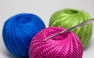 Colored yarn balls with crochet hook 