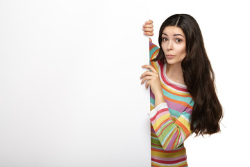Smile woman standing pointing her finger at board