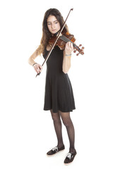 teenage girl plays violin in studio