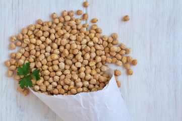 Hummus, chick peas on a vintage wooden background