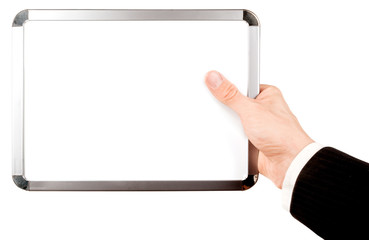 Businessman in suit holding an empty whiteboard (magnetic board)
