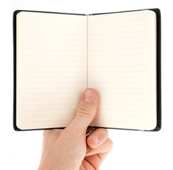 Hand holding an empty notepad (notebook) isolated on white
