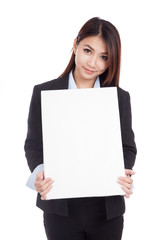 Naklejka premium Young Asian businesswoman show vertical blank sign
