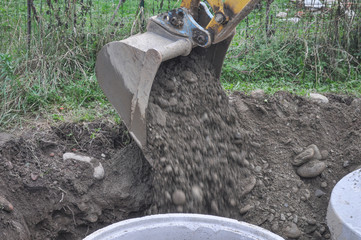 Excavator digging a hole