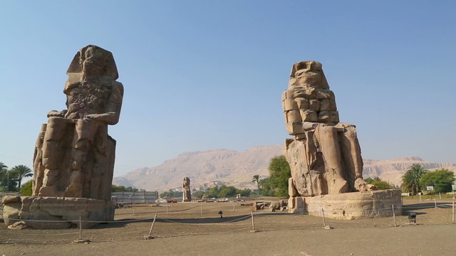 colossi of memnon gigantic statues in Luxor Egypt - pan view