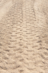 Closeup of 4x4 tyre tracks in the desert