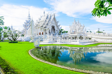 grand white church with reflection in the pond,wat rong khun,Chi