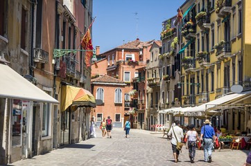 street in historic Venice, Italy with beautiful monument