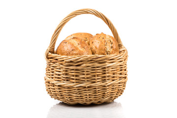bread in wicker basket isolated on white