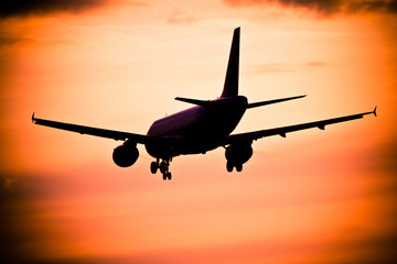 Airplane landing at sunset, Frankfurt, Germany