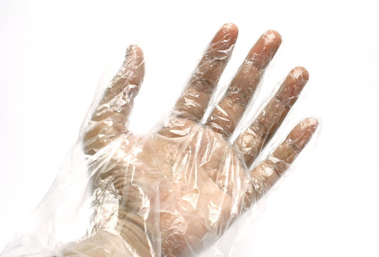 Hand with Plastic gloves on white background