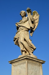 Fototapeta na wymiar Sculpture of an angel on Ponte Sant'Angelo, Rome, Italy