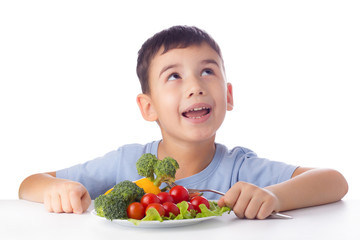 Boy eating vegetables