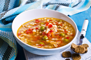 Soup with small pasta, vegetables and pieces of meat