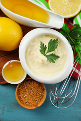 Mayonnaise ingredients on wooden background