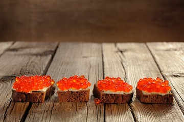 Red caviar on rye bread and butter